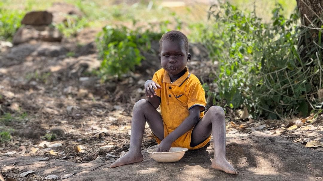 School feeding programme supporting a child in Karamoja