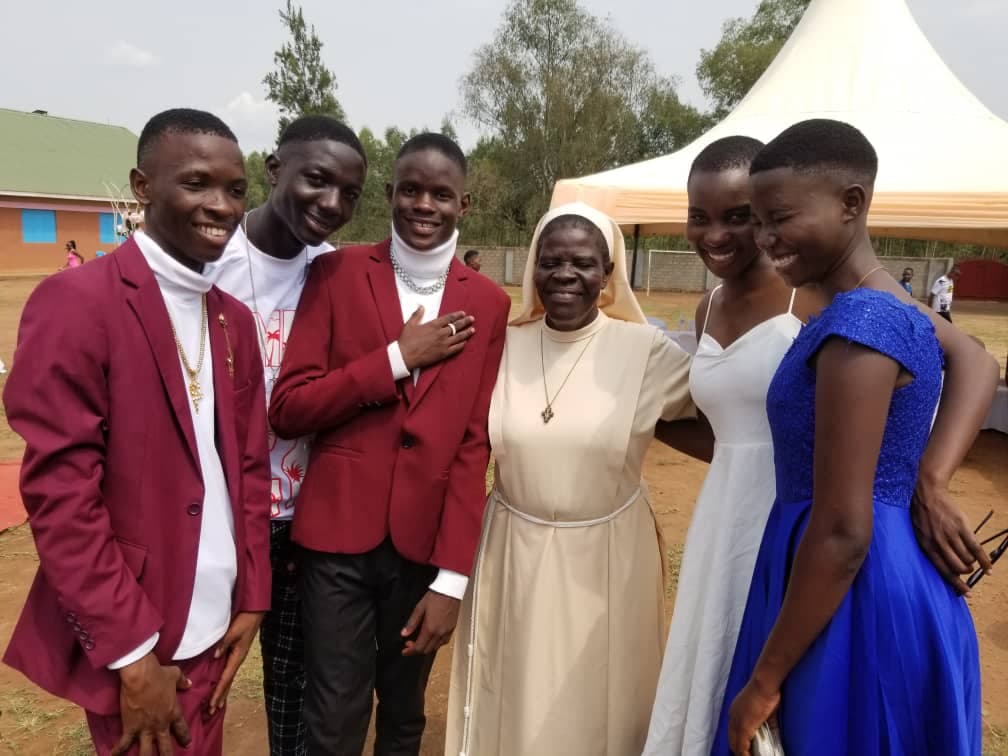 Sister Clare Mary Busingye with Scholarship Children